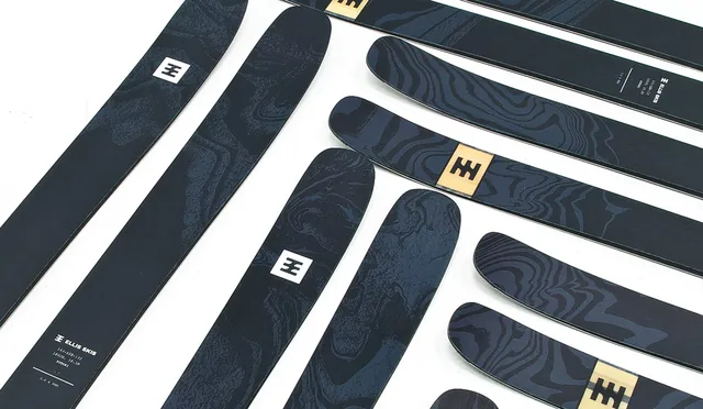 Ellis Skis topsheets laid out in a pattern on a white floor.