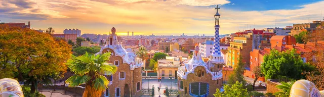 Panoramic view of Barcelona at sunrise from Park Guell, the banner image of the Explore Worldwide competition page.