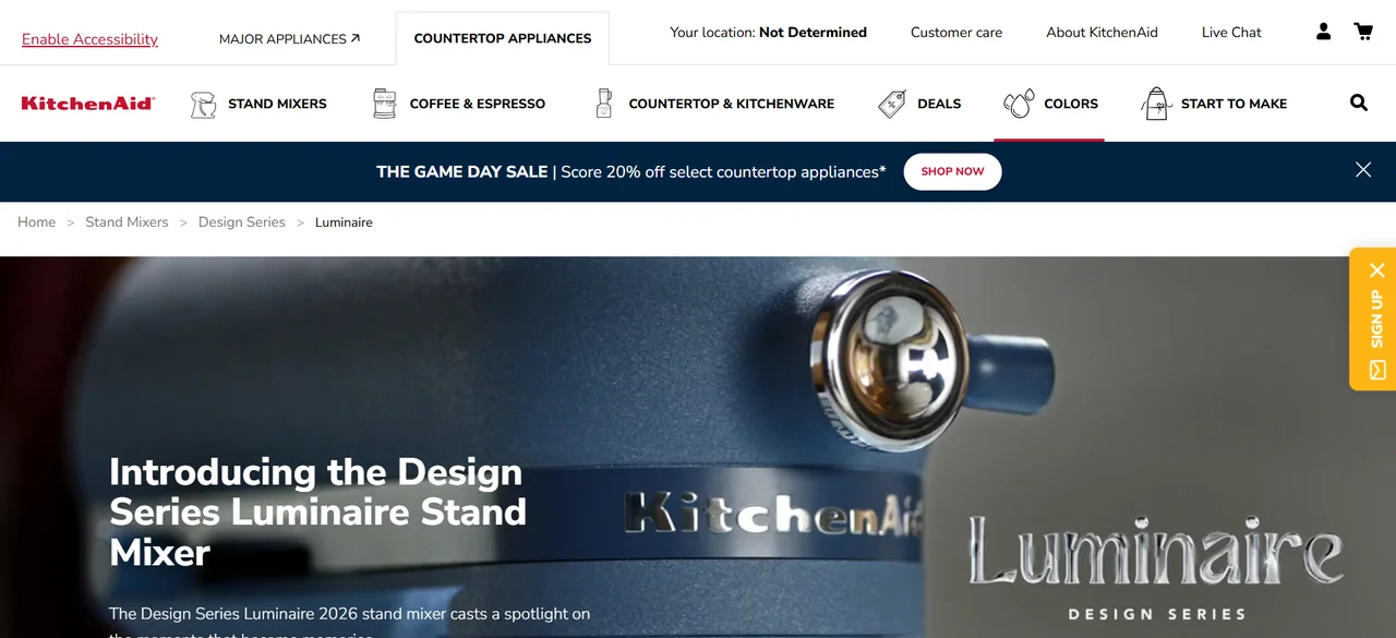 Official KitchenAid Luminaire campaign page showing the Design Series stand mixer hero section.
