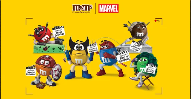 M&M's and Marvel promotion artwork with colored M&M's characters dressed as Deadpool, Wolverine, Daredevil, Yelena and She-Hulk on a yellow background.