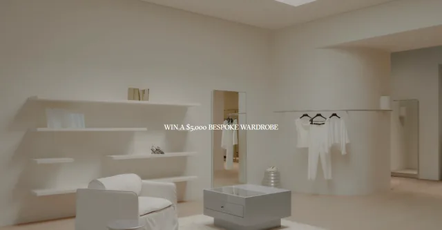 Viktoria & Woods boutique interior with a rail of white garments, a mirror and a chair, with the text 'Win a $5,000 bespoke wardrobe'.